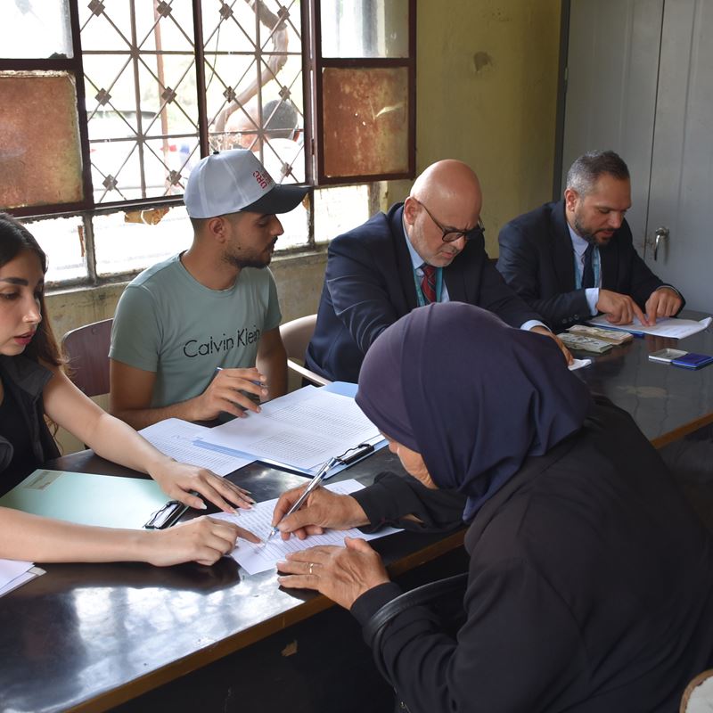 A woman from Balloran receives cash assistance.