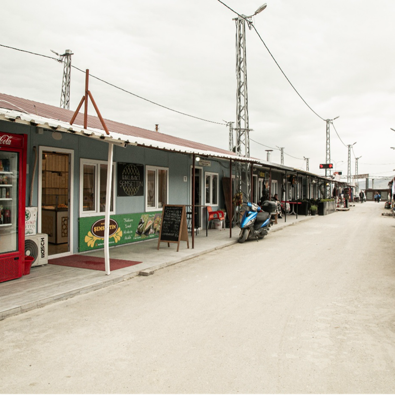 Temporary shop structures in Hatay established following the February 2023 earthquakes provide displaced business owners with a space to restore their livelihoods and serve local communities in the affected region.